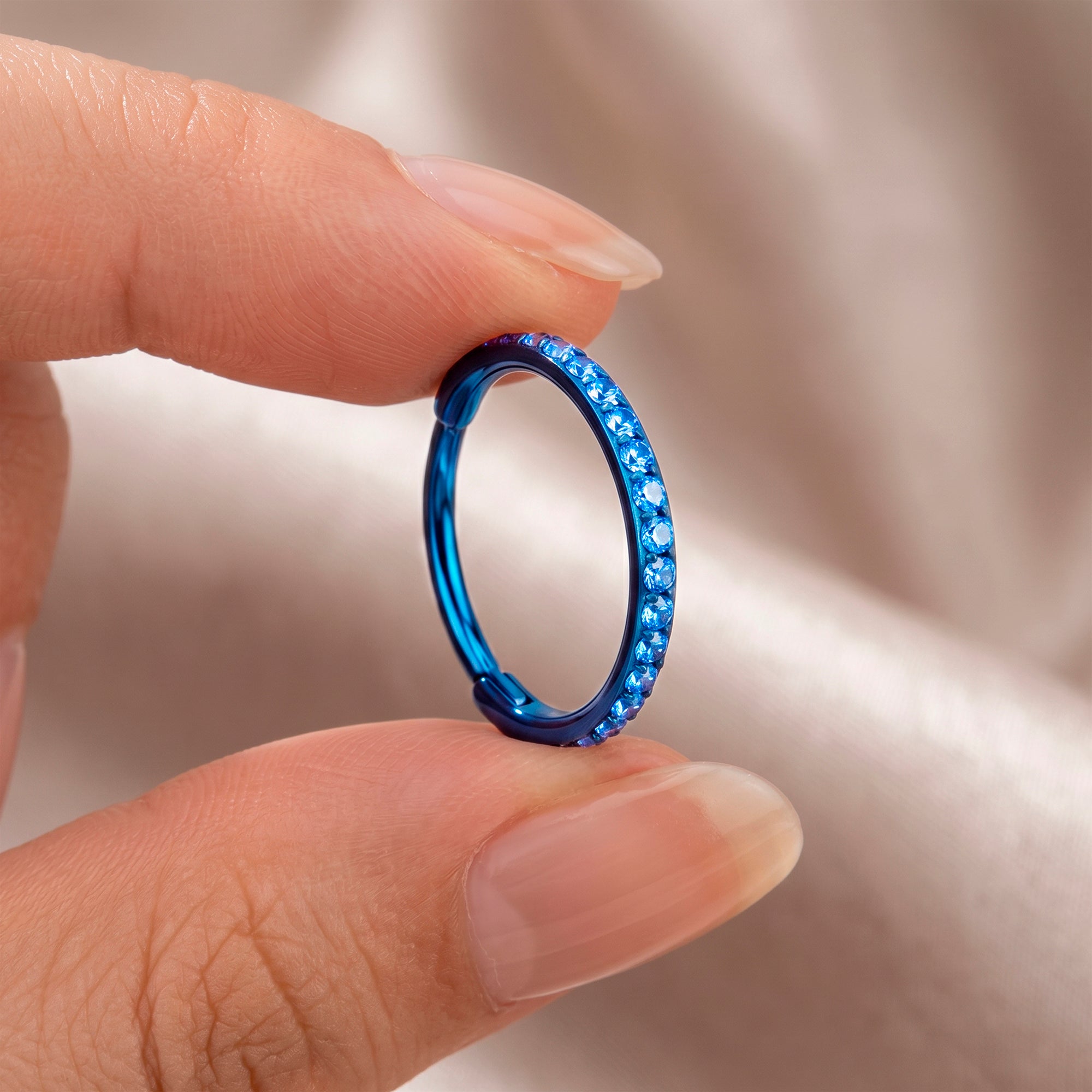 Titanium blue gem clicker hoop for nostril piercing