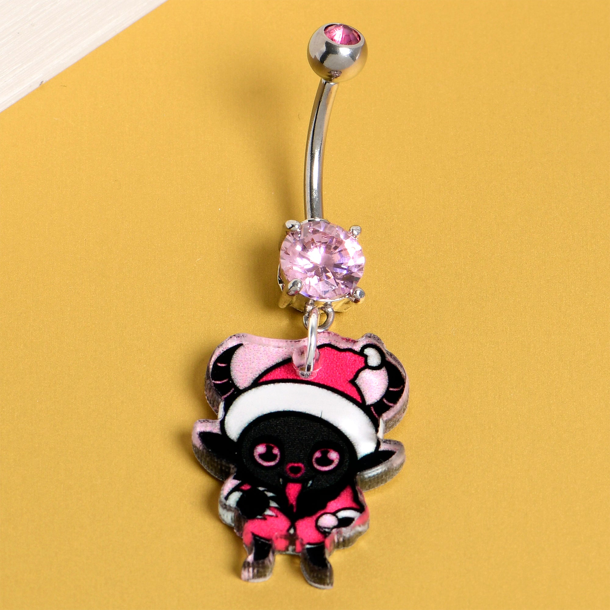 Festive Krampus dangle belly ring with double pink accents