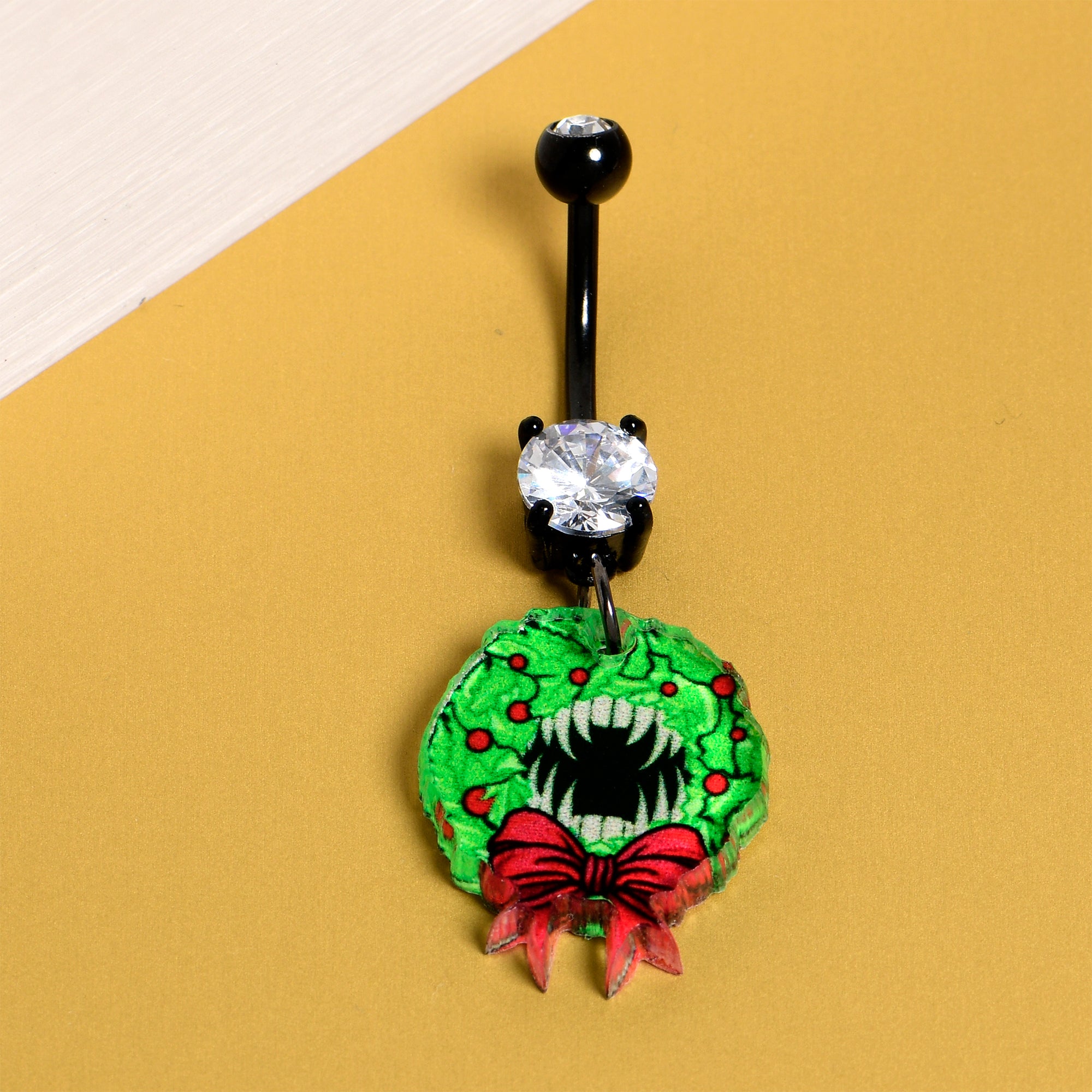 Festive wreath dangle belly ring with black accents