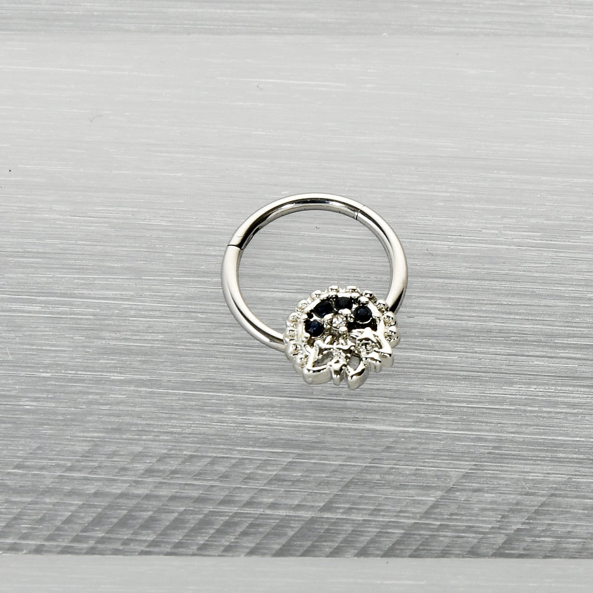 16G 3/8 Clear Blue Gem Abstract Arch Hinged Segment Ring