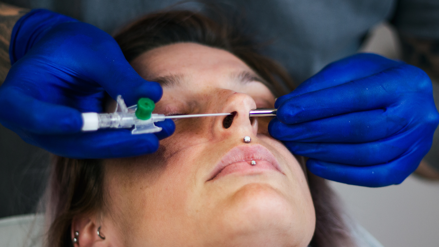 Woman Getting A Septum Nose Piercing