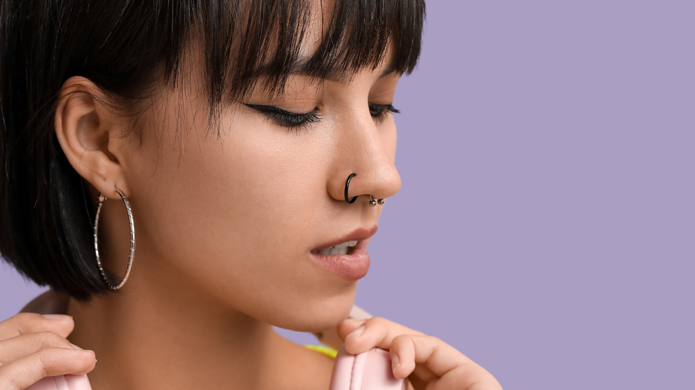 Woman With Piercings Looking Down