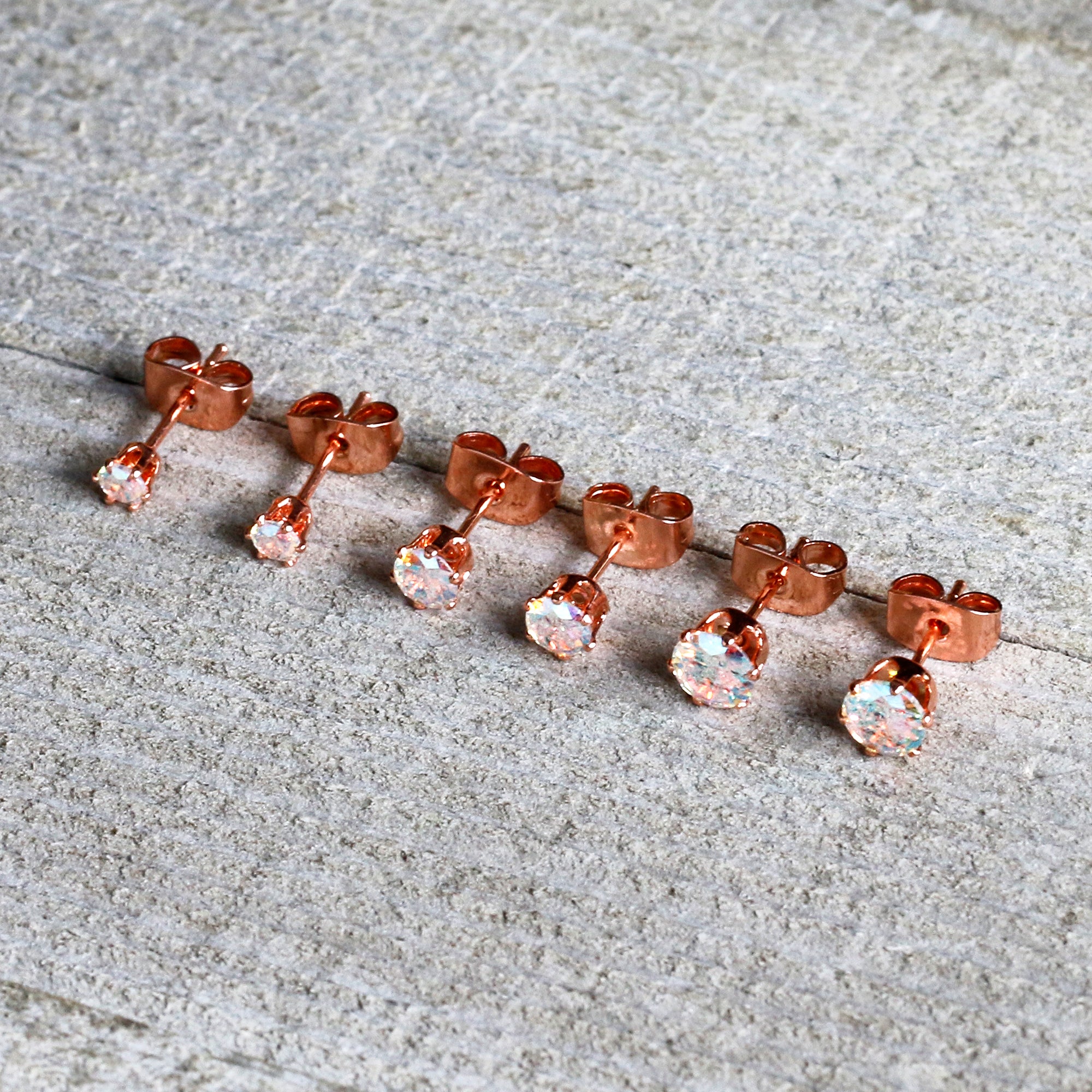 20 Gauge Rose Gold Tone Stud Earrings with Aurora CZ Stones