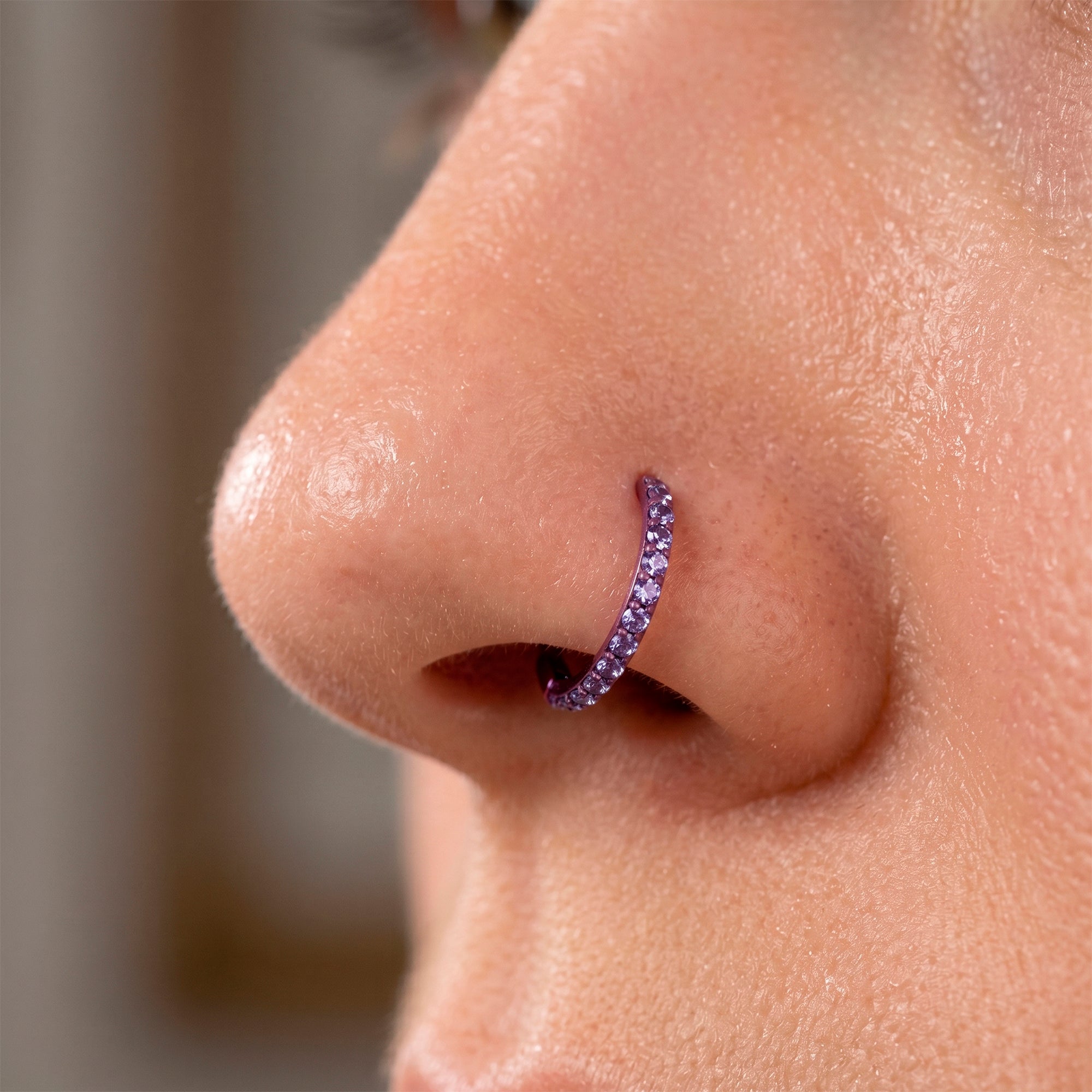 Titanium purple hinged nose clicker piercing