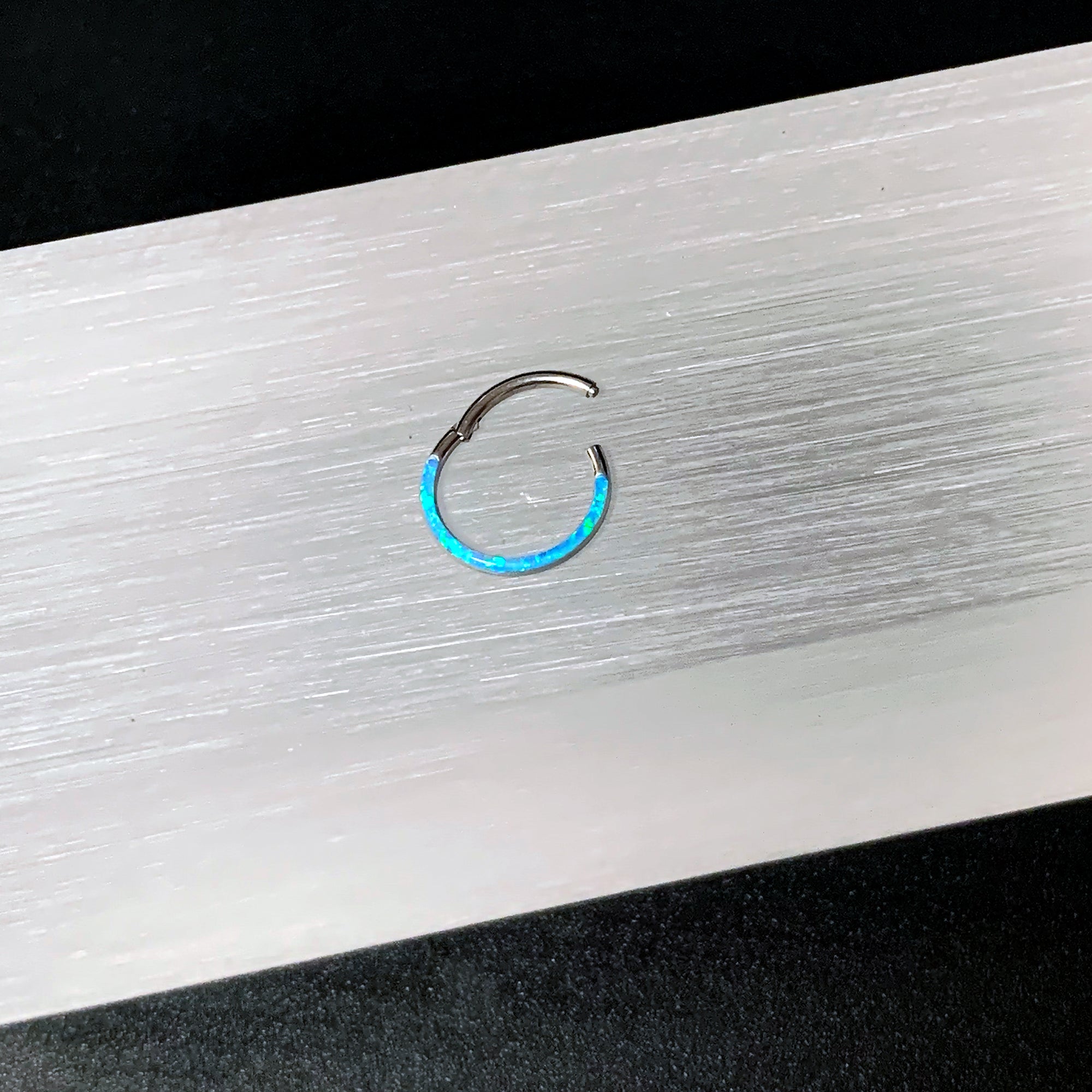 16 Gauge 3/8 Aqua Synthetic Opal Bottom Curve Hinged Segment Ring