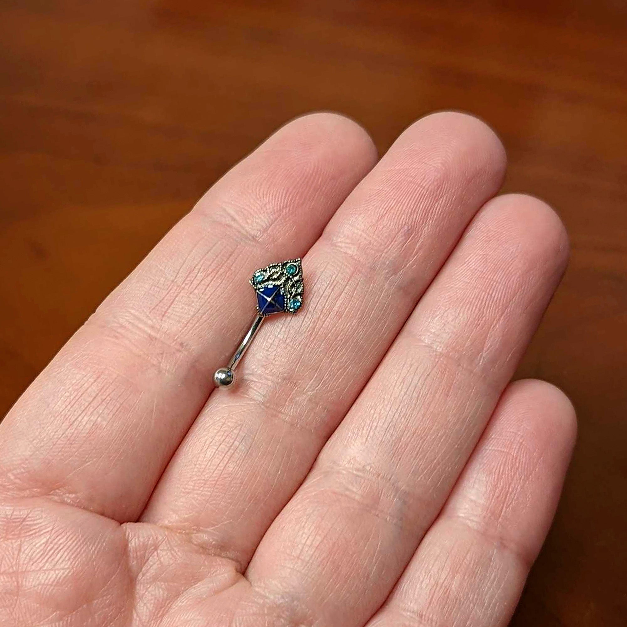 16G 5/16 Blue Gem Rococo Blue Curved Eyebrow Ring